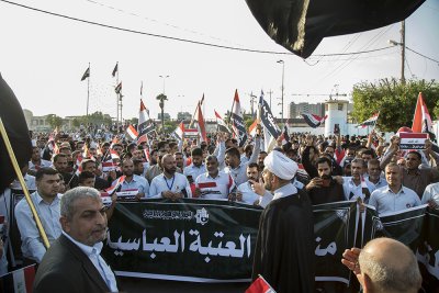 منتسبو العتبة العباسّة المقدّسة يخرجون بمسيرةٍ حاشدةٍ تصدحُ بحب العراق